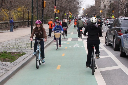 Bicyclists on the Prospect Park West bike lane. From Inhabitat.