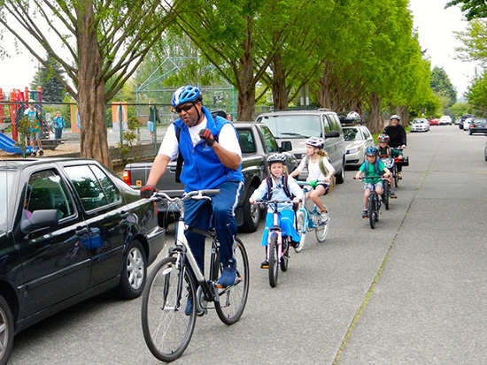 Loyal Heights Elementary principal Wayne Floyd leading a bike train, photo by Clint Loper.