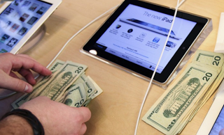The new iPad, and a bunch of money, from appadvice.com.