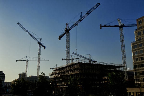 Cranes busy putting up new buildings in Washington, D.C., from Bloomberg.