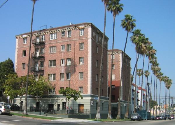 A common example of an existing building that is unlikely to be redeveloped, but will feel pressure to be renovated to appeal to a higher-earning demographic without an adequate supply of new housing—and which could be protected if it were purchased…