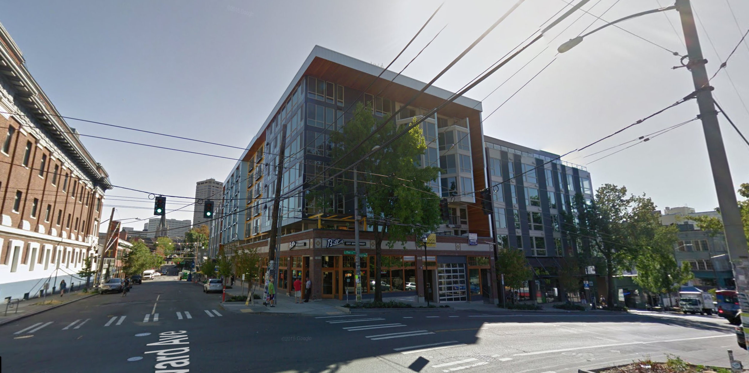 A new building in Seattle's Capitol Hill neighborhood, where the facade was maintained and 5 stories of housing were built above it. The pre-redevelopment business, a bar named Bill's Off Broadway, returned to its location on the ground floor when d…