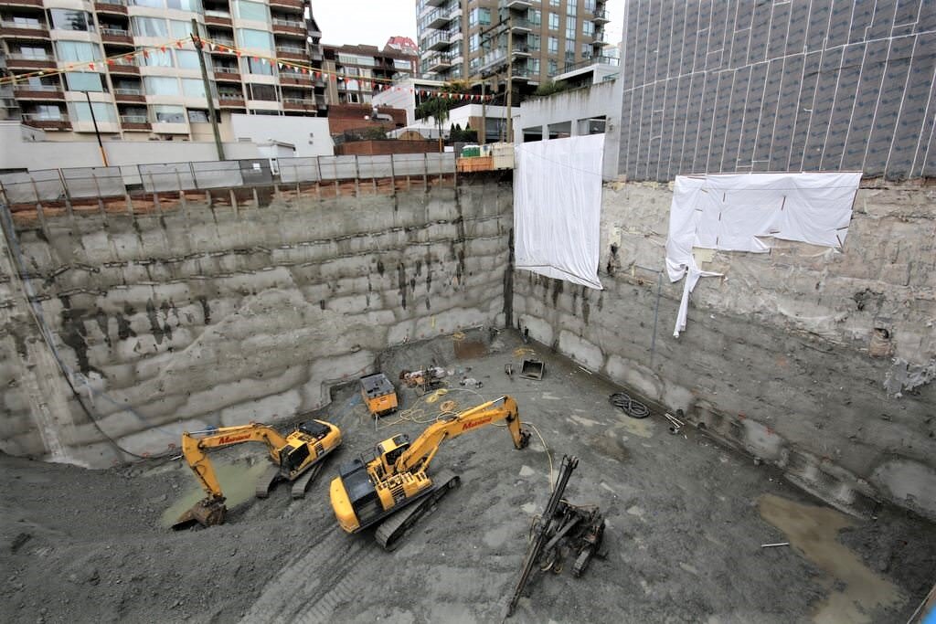Massive digging operations like this, which are often required to provide underground parking, plus the parking construction itself, can cost upward of $50,000 per space. Photo by City of Rain.